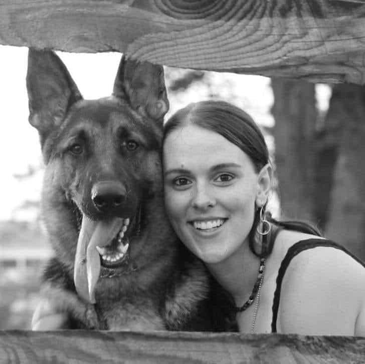 german shepherd with woman posing