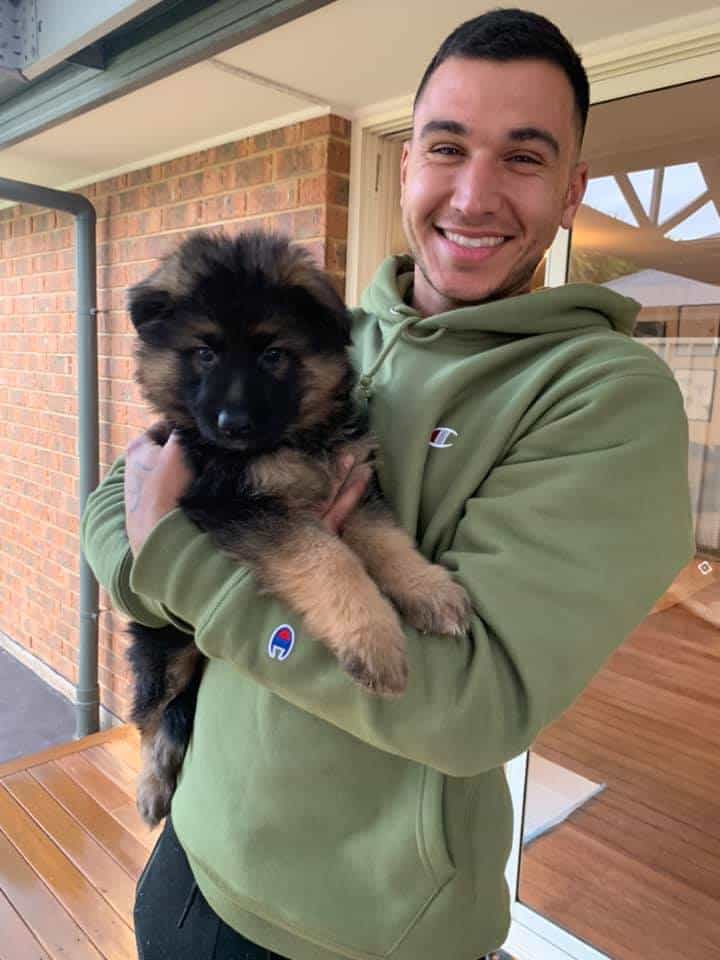 happy man with cute puppy