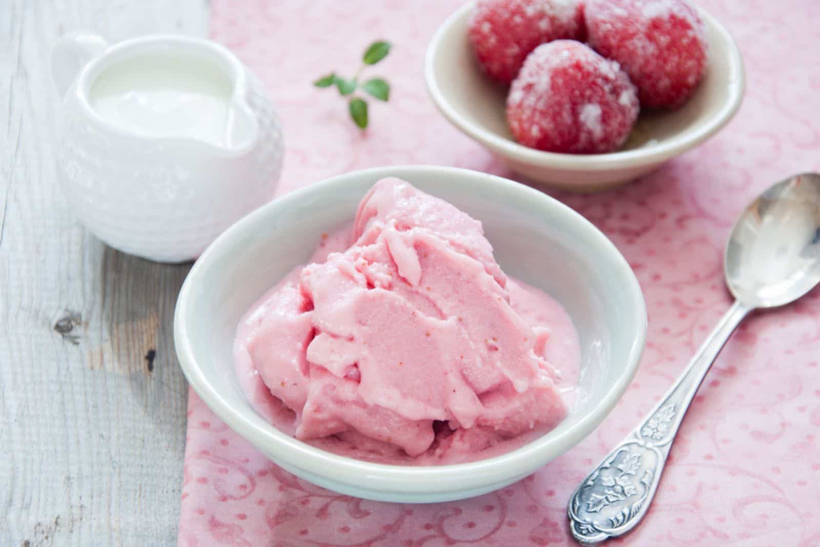 homemade frozen strawberry yogurt in a bowl