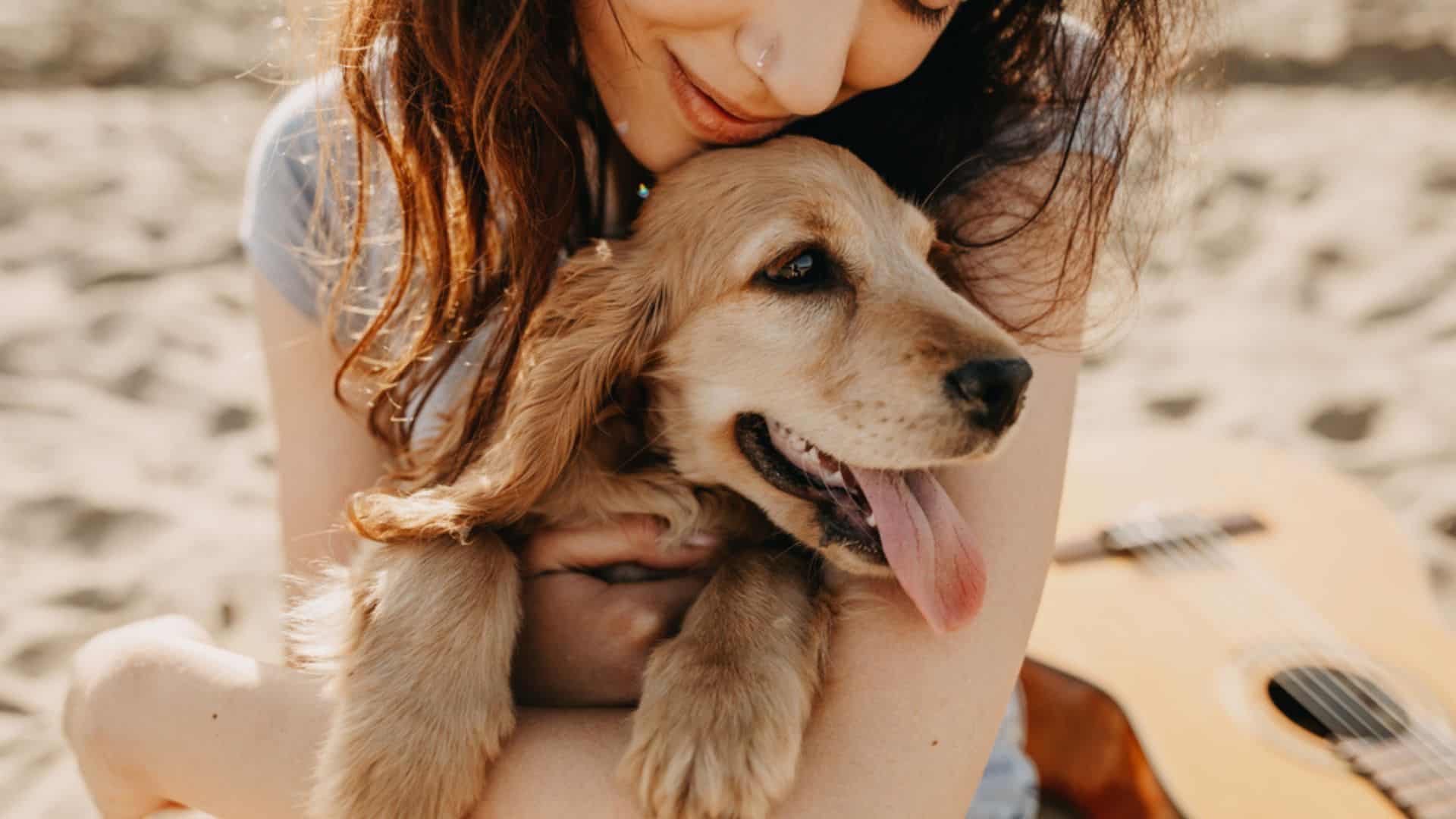 woman hugging a dog