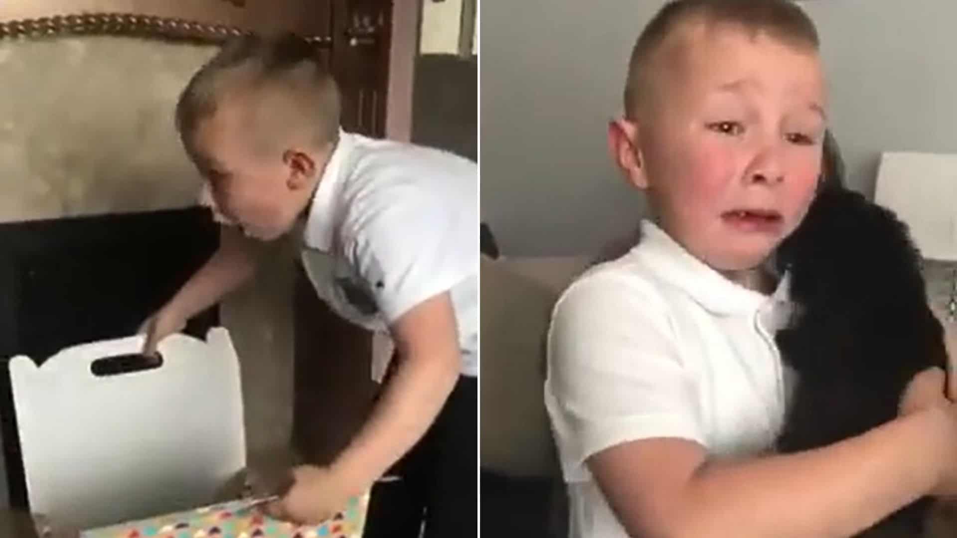 crying boy hugging a puppy