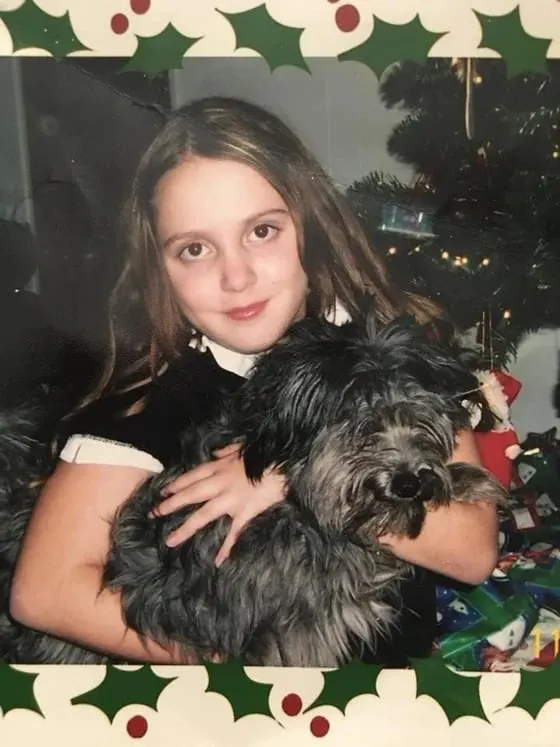 picture of a girl holding her dog