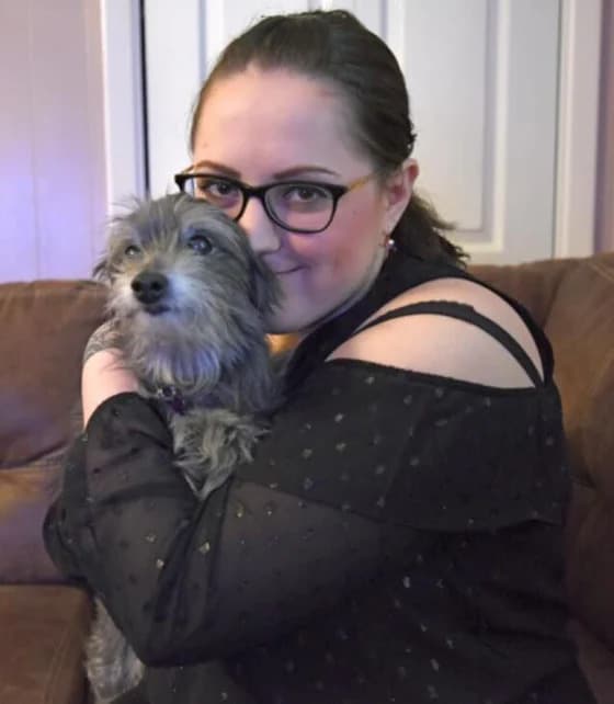 woman hugging her childhood dog