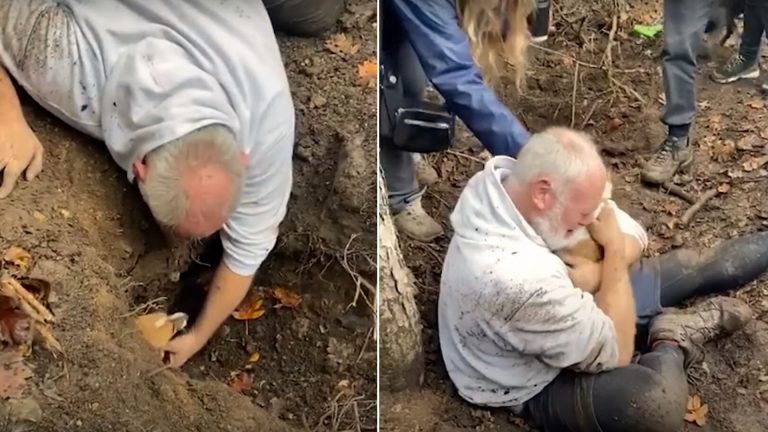 man crying while holding a dog