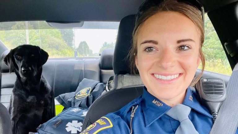 photo of the state trooper and a dog