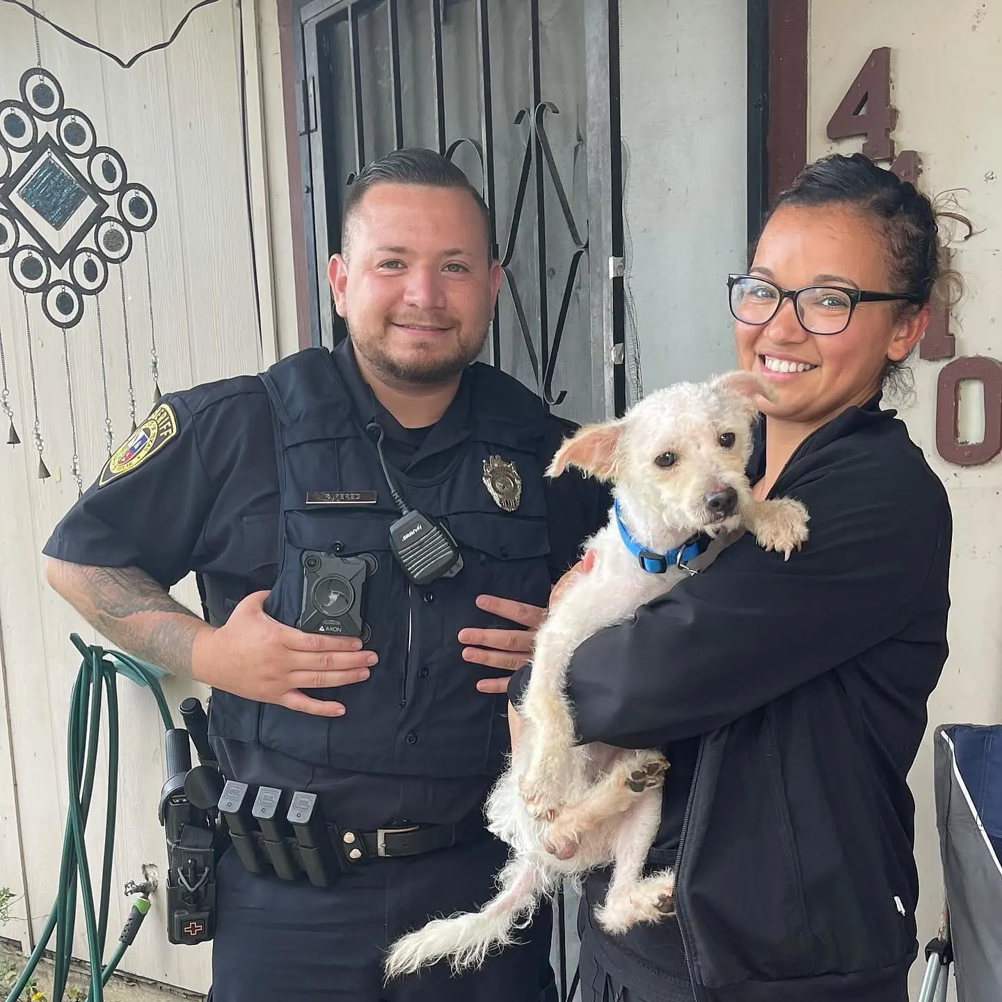 police officer standing next to a girl holding the missing dog