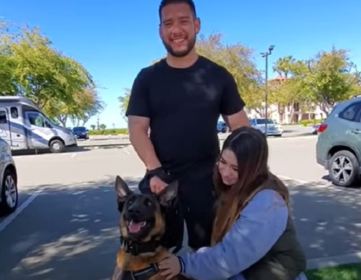 girl, guy and their dog