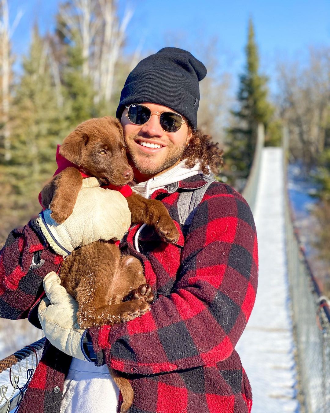 guy holding his puppy