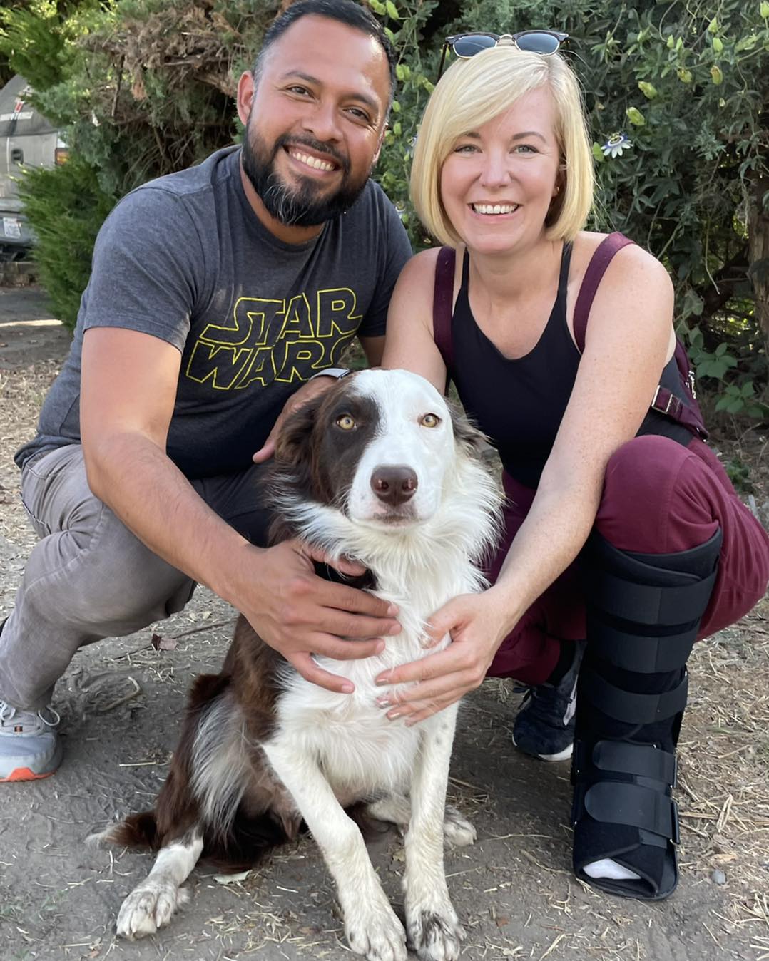 photo of dog rocky with a man and a woman