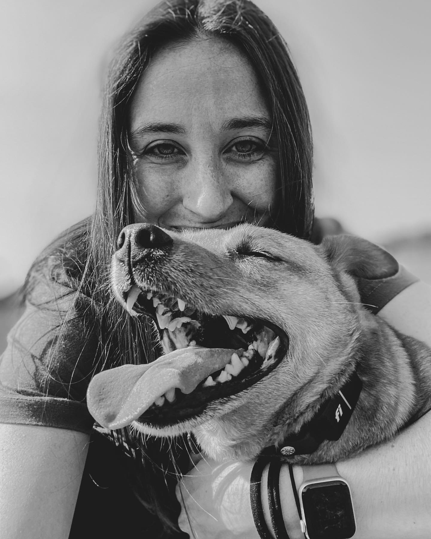smiling young woman with happy dog