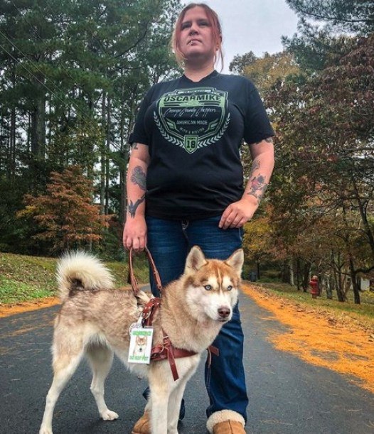 tatooed girl and her dog