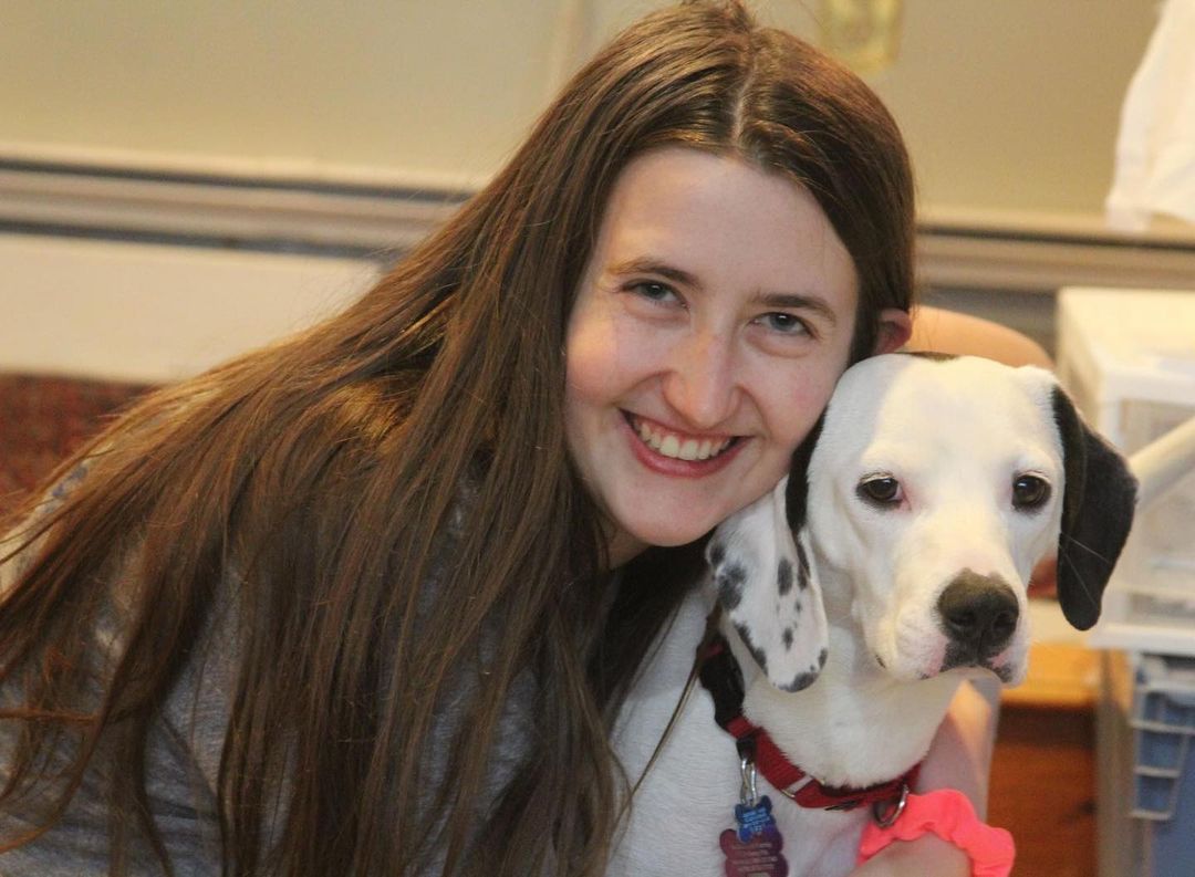 woman hugging the dog
