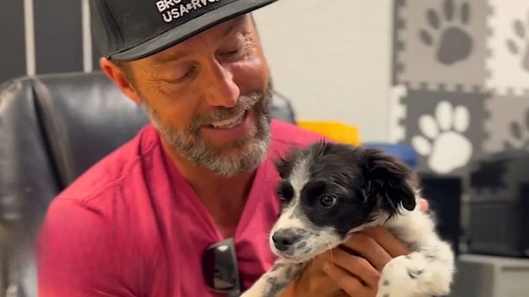 guy holding a dog