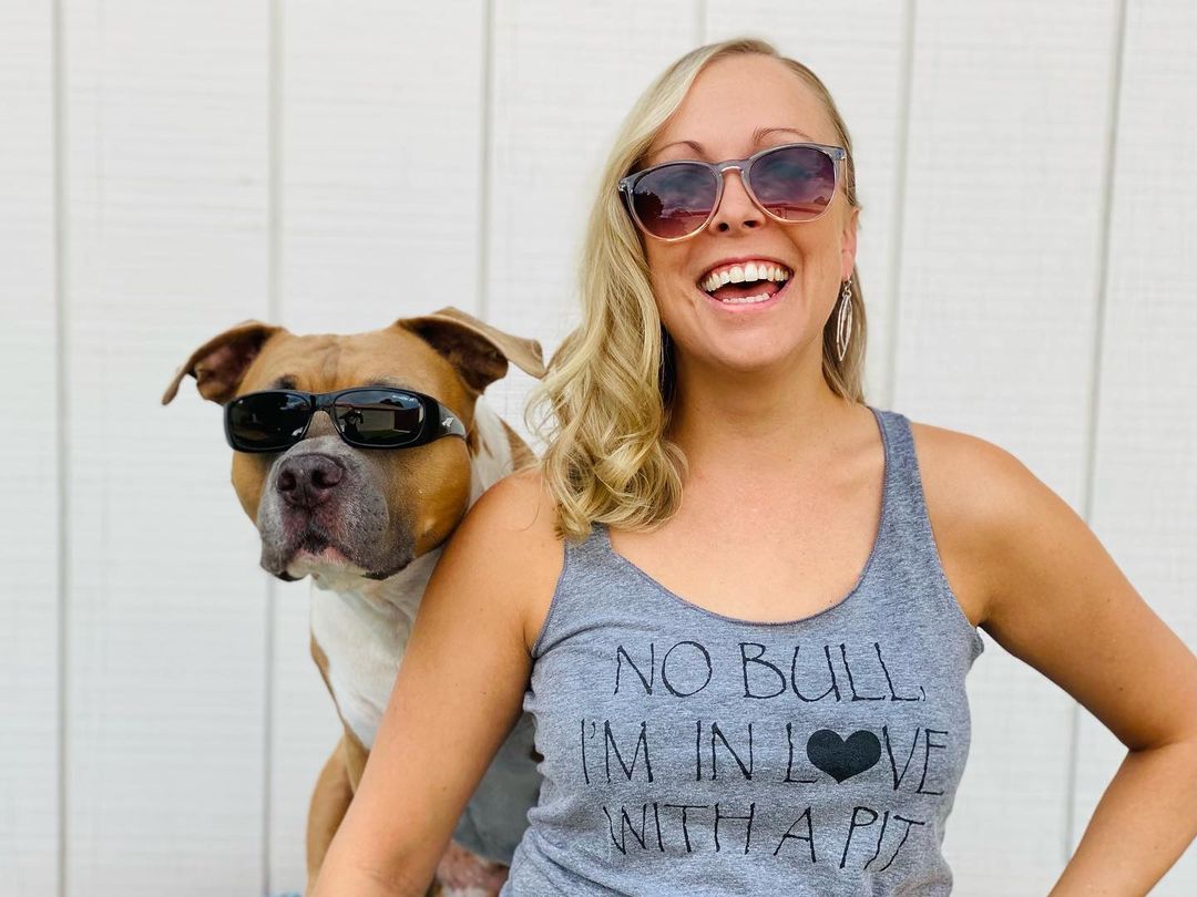 girl and dog wearing glasses