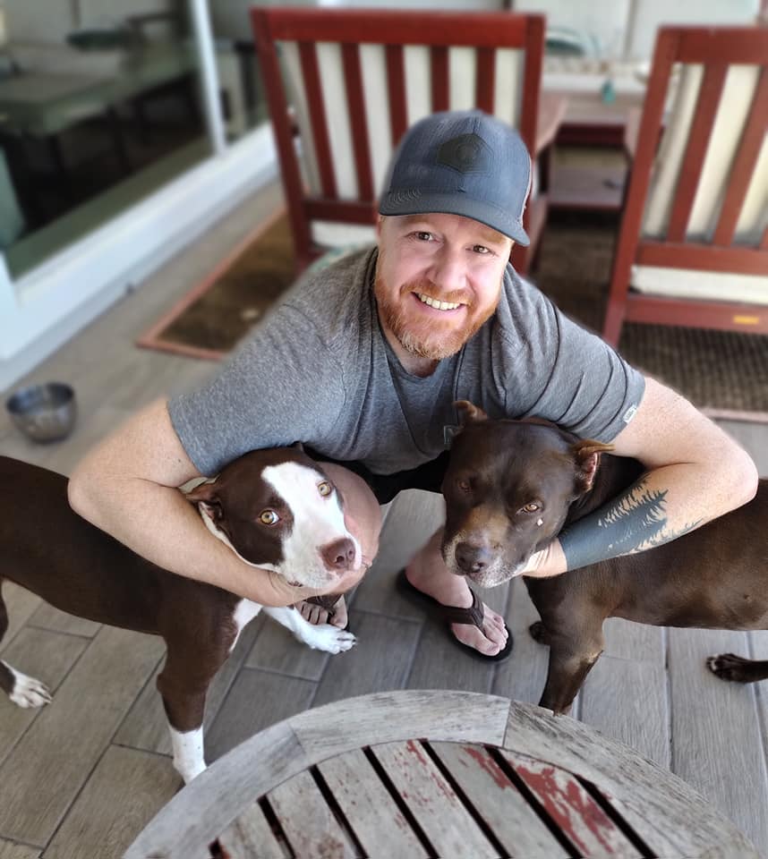 guy and his two dogs