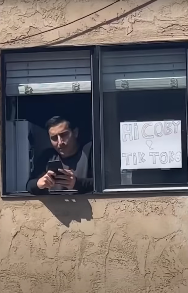 man standing at the window