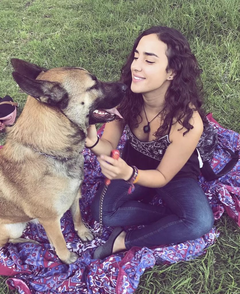 smiling woman and dog in the park