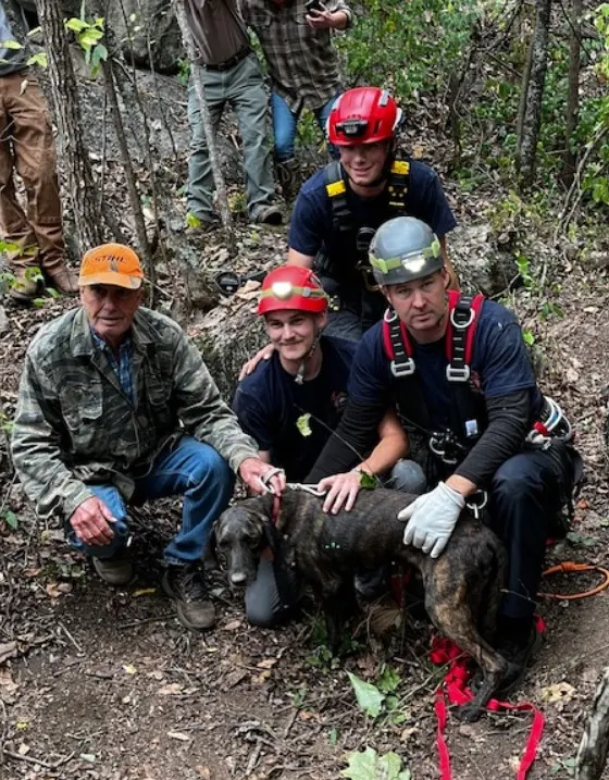 the rescuers who rescued the dog from the cave