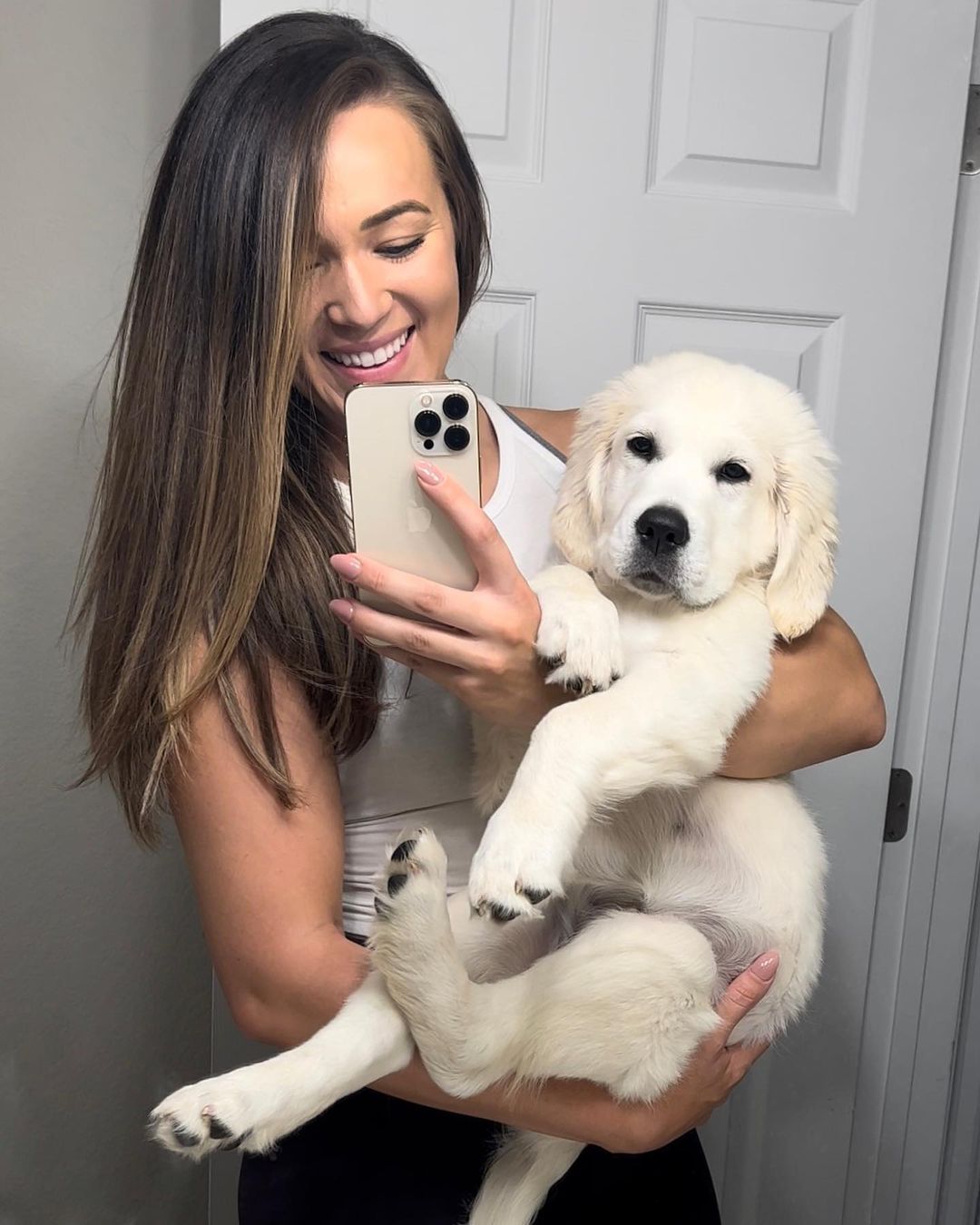 woman holding the puppy