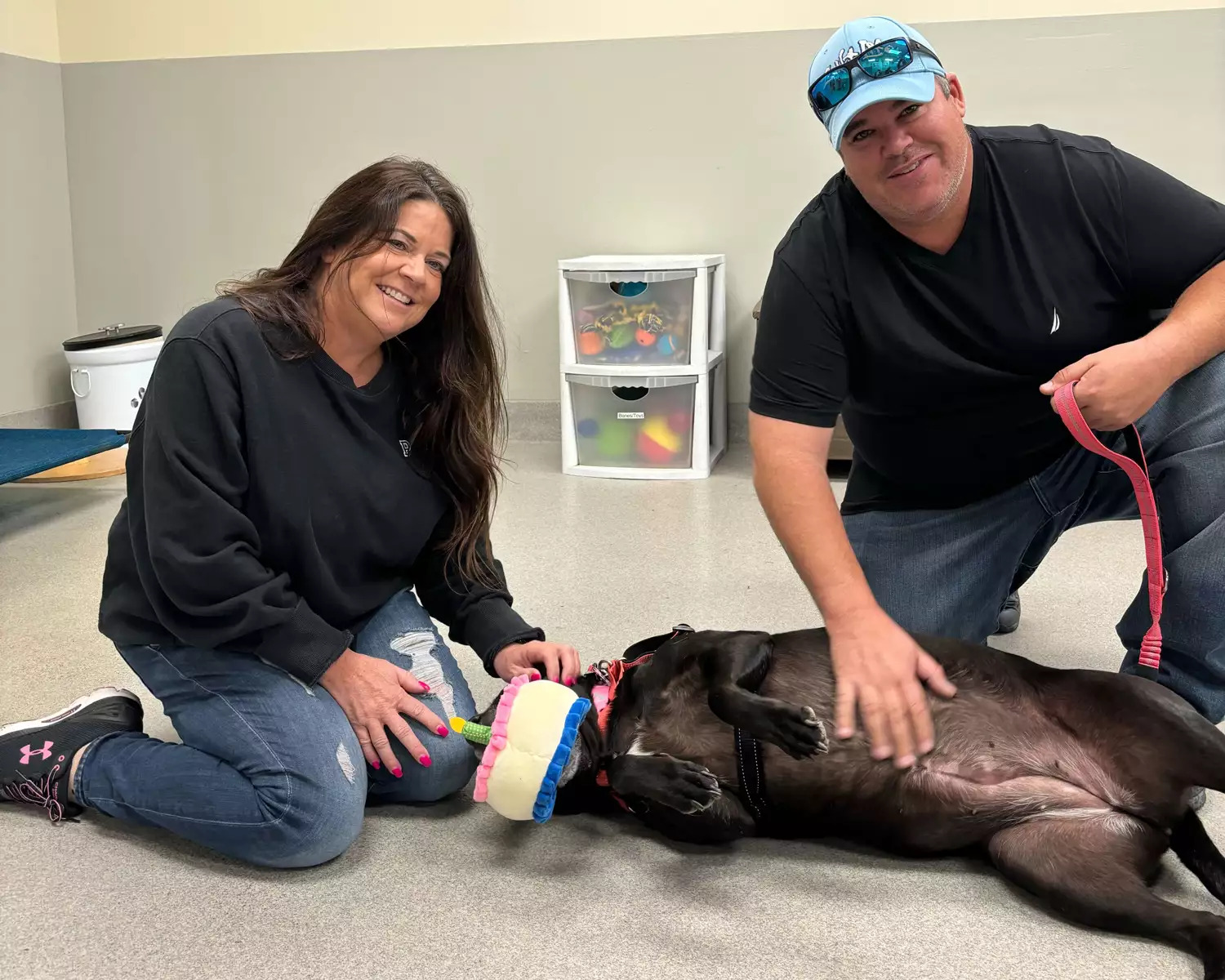 Couple and black dog