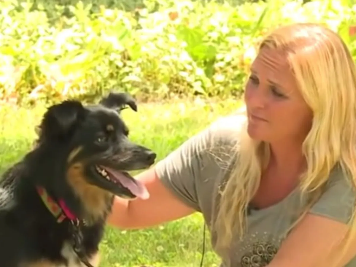 photo of woman and a dog