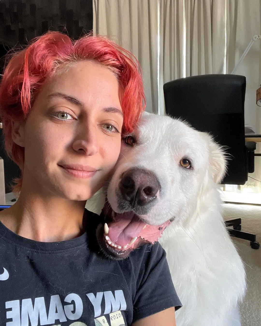 red headed owner and white dog