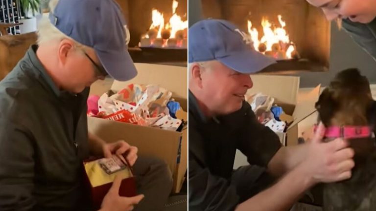 man opening a Christmas present
