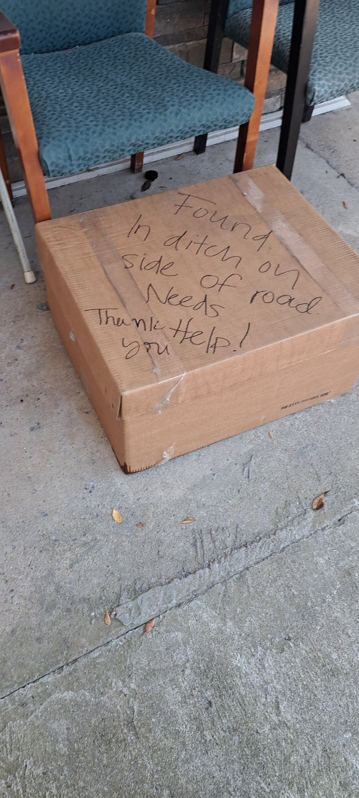 a box with a written sign