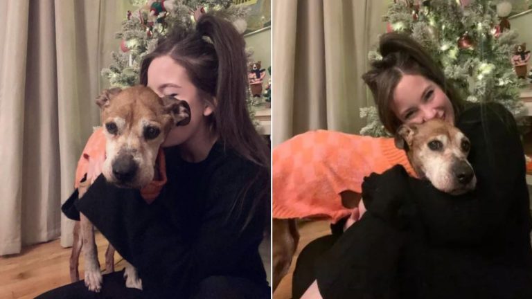 woman holding her dog