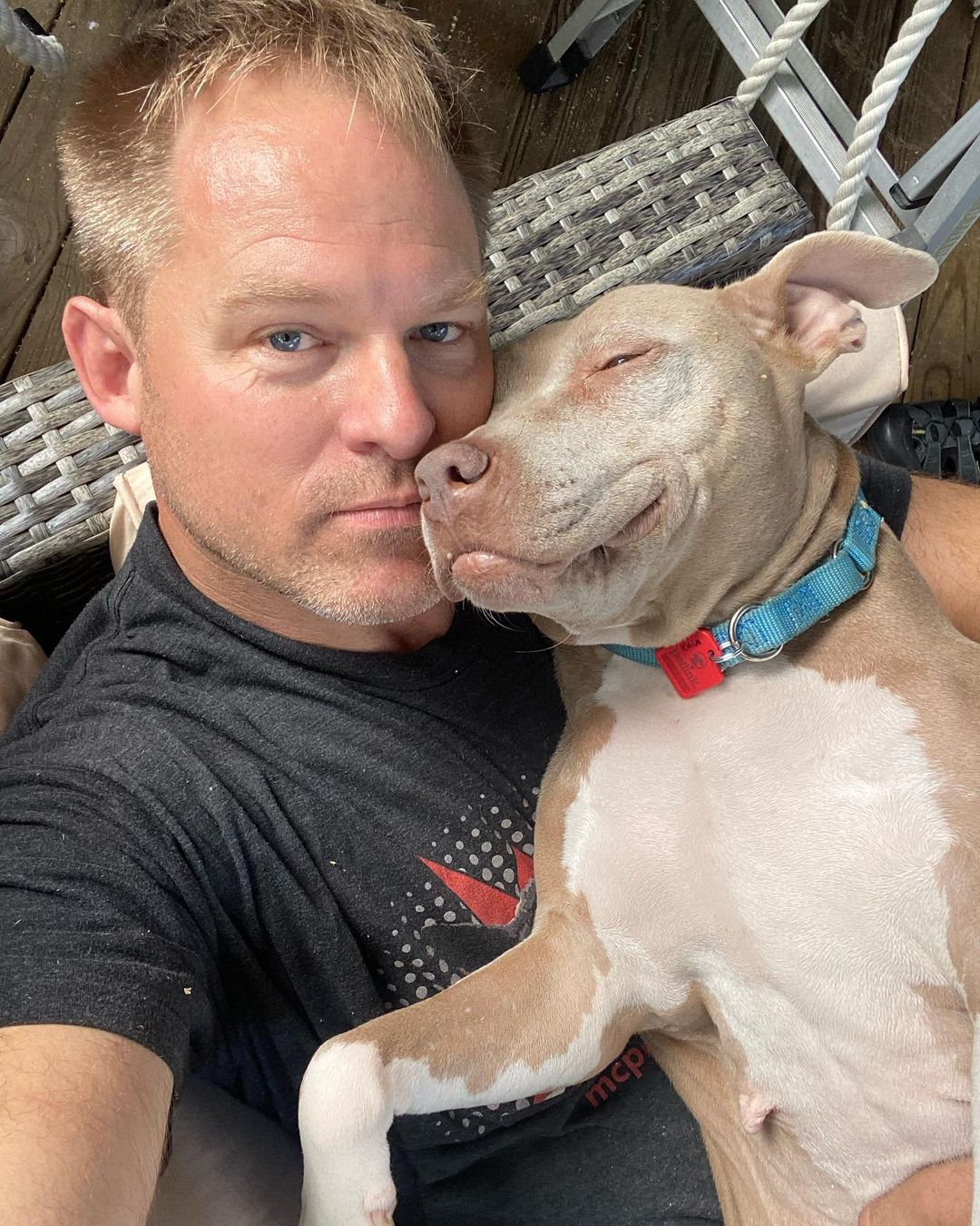 photo of man and pit bull