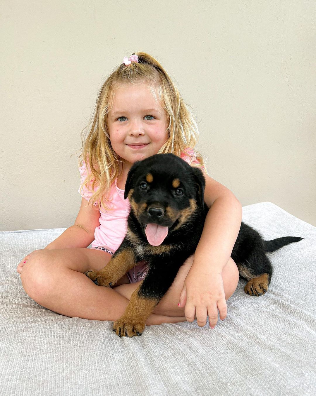 photo of puppy and a little girl