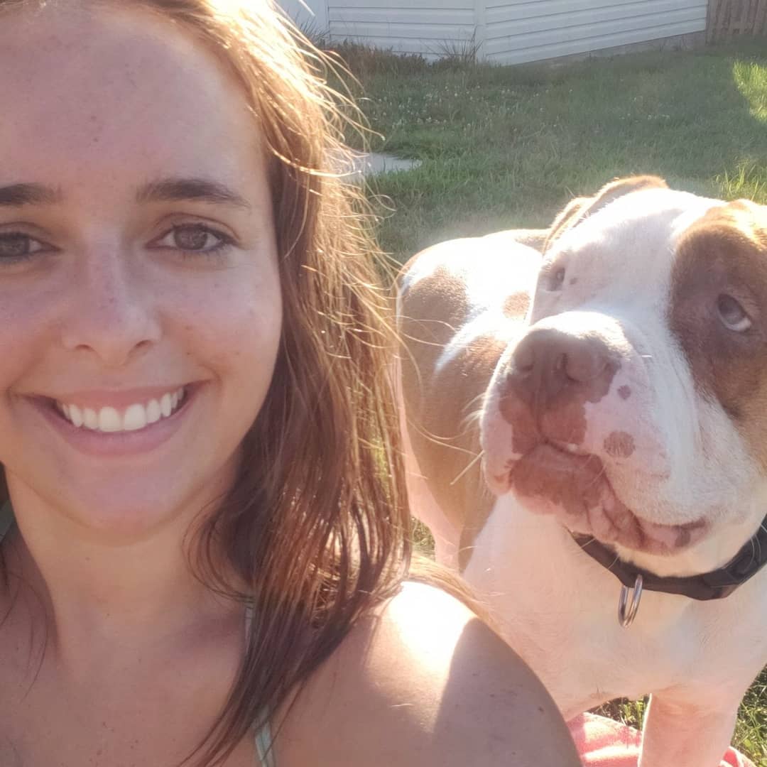 photo of woman and a pitbull