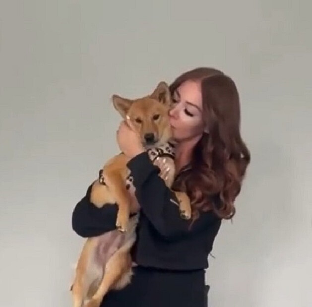 woman holding rosie the dog