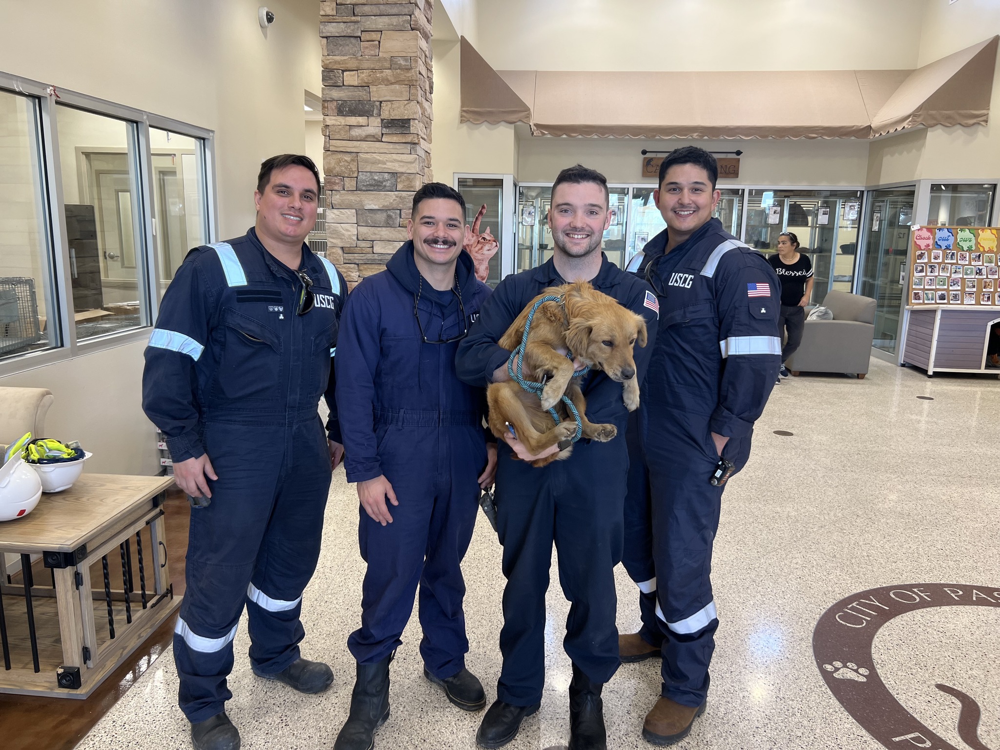 Four Coast Guards and dog