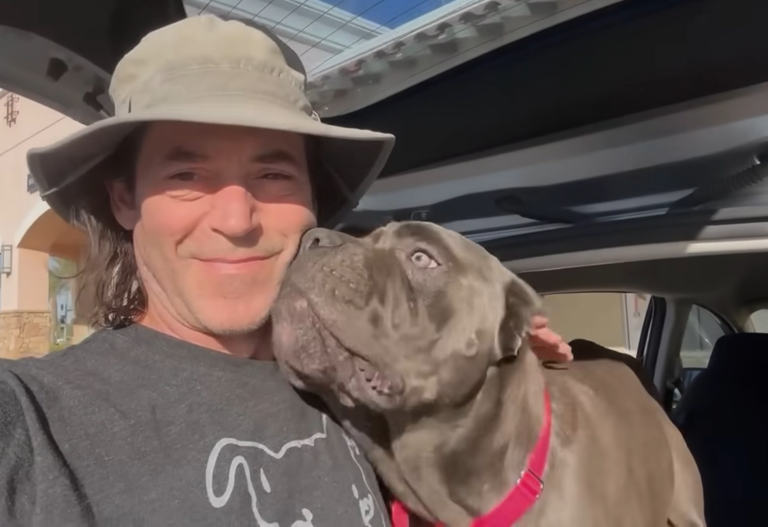 guy with hat and cane corso