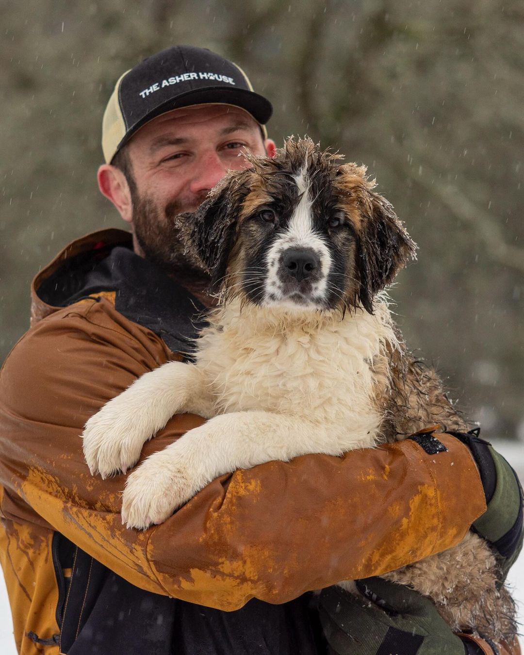 man holding a dog