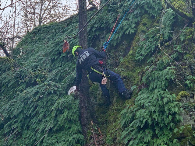rescuer climbing on a hill