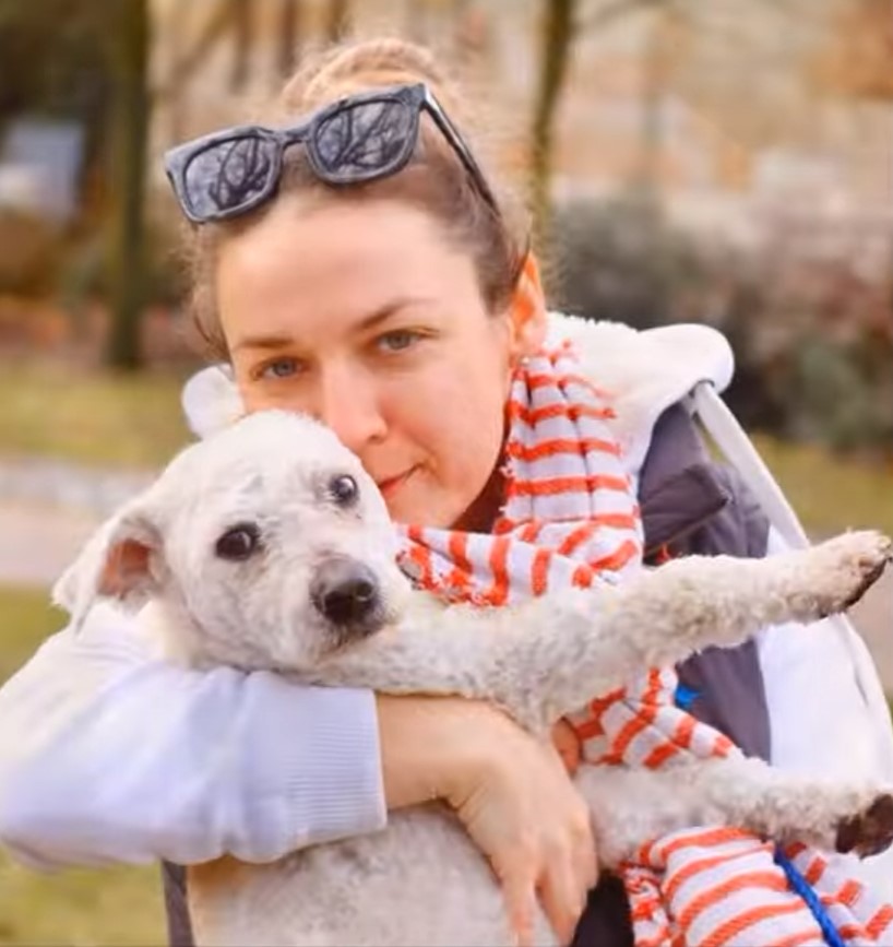 woman hugging a dog