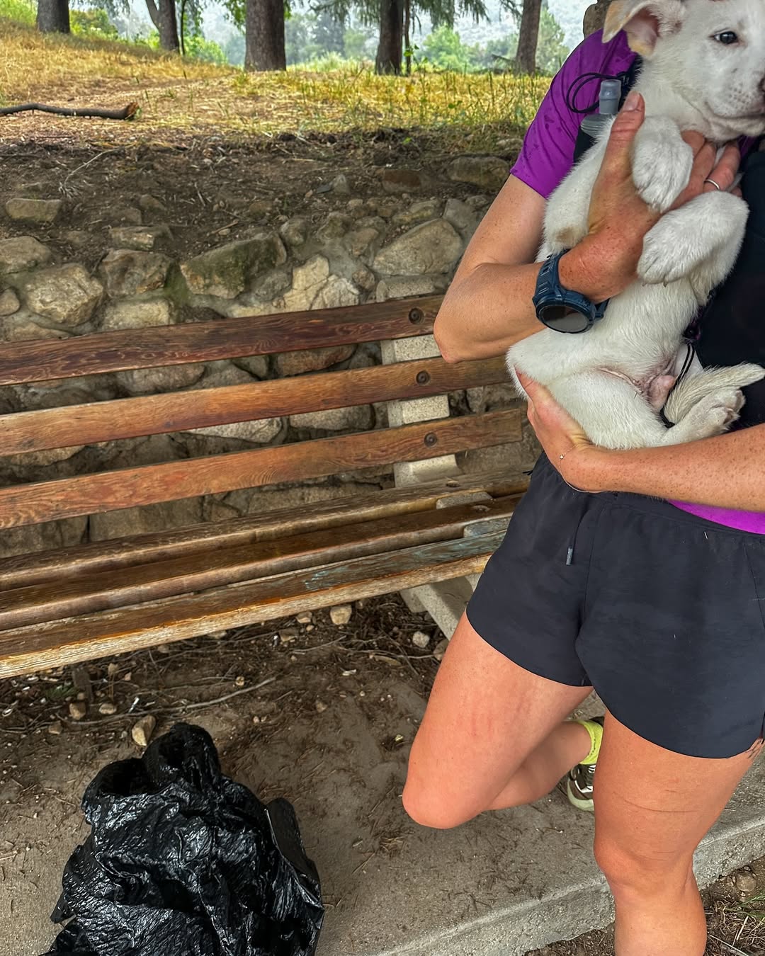 Woman holding an abandoned dog