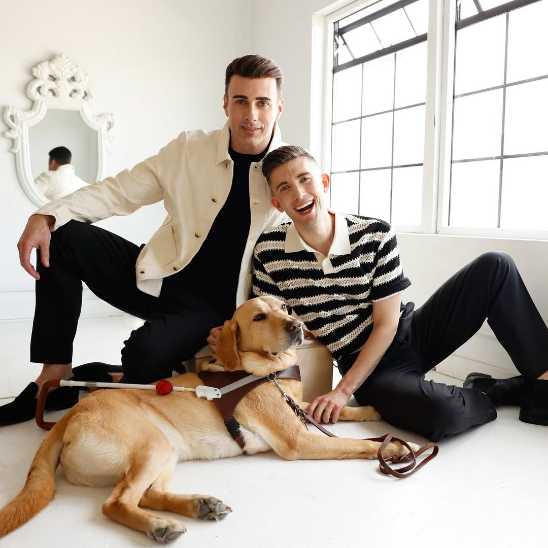 men and dog laying