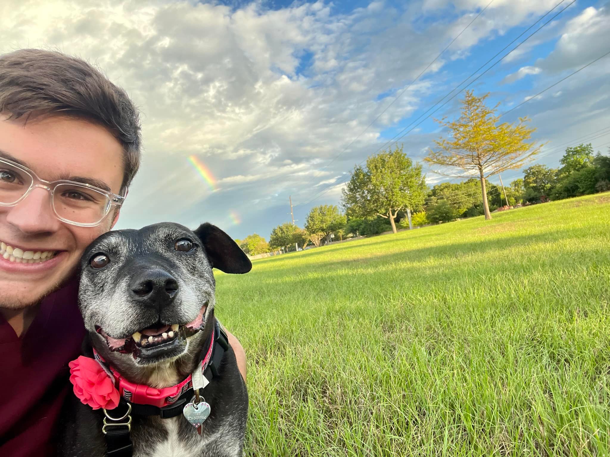 owner and dog posing for picture