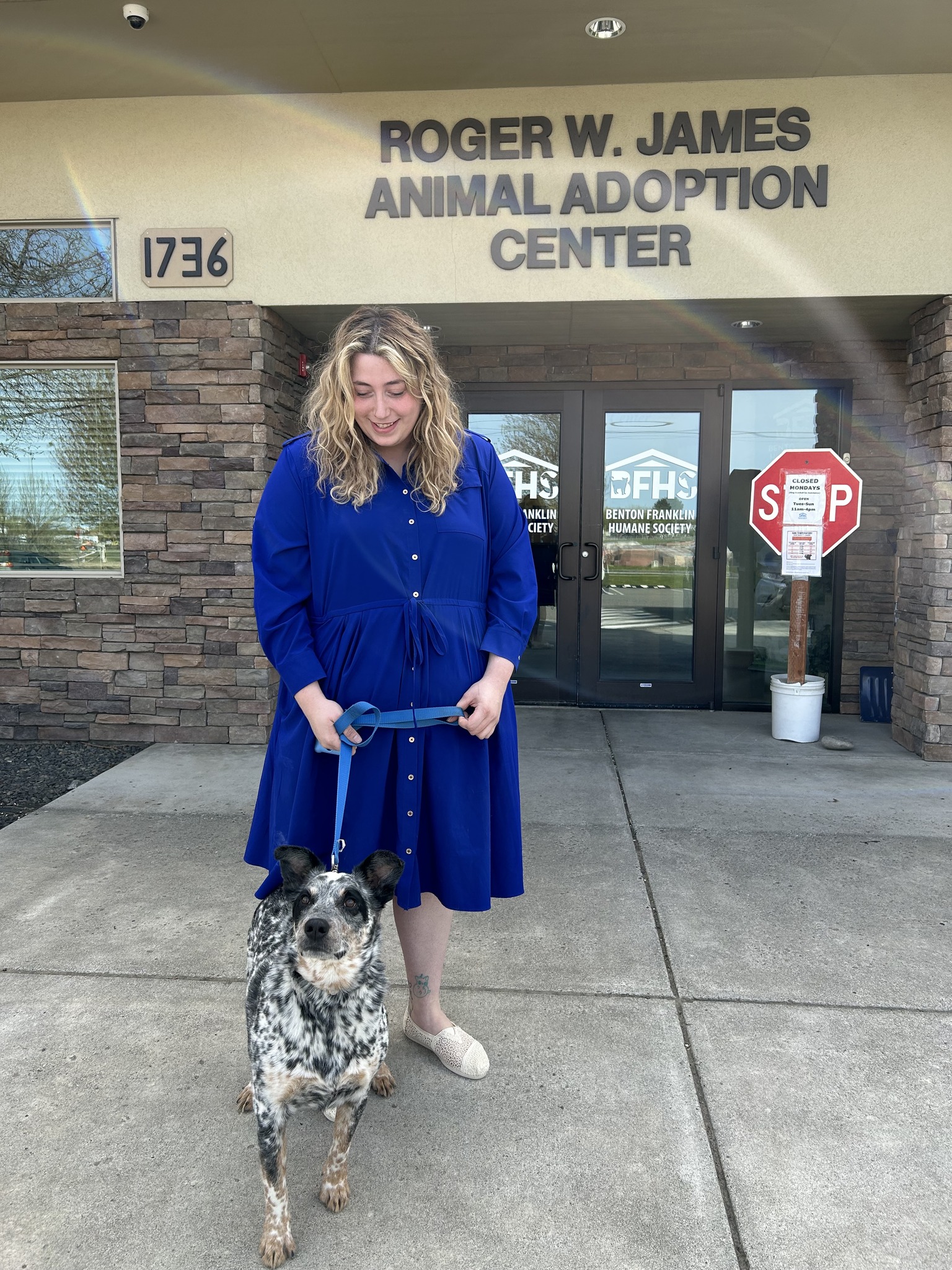 blonde woman and dog on leash