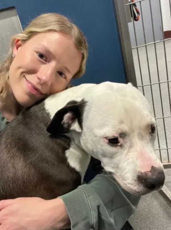 blonde woman and white dog