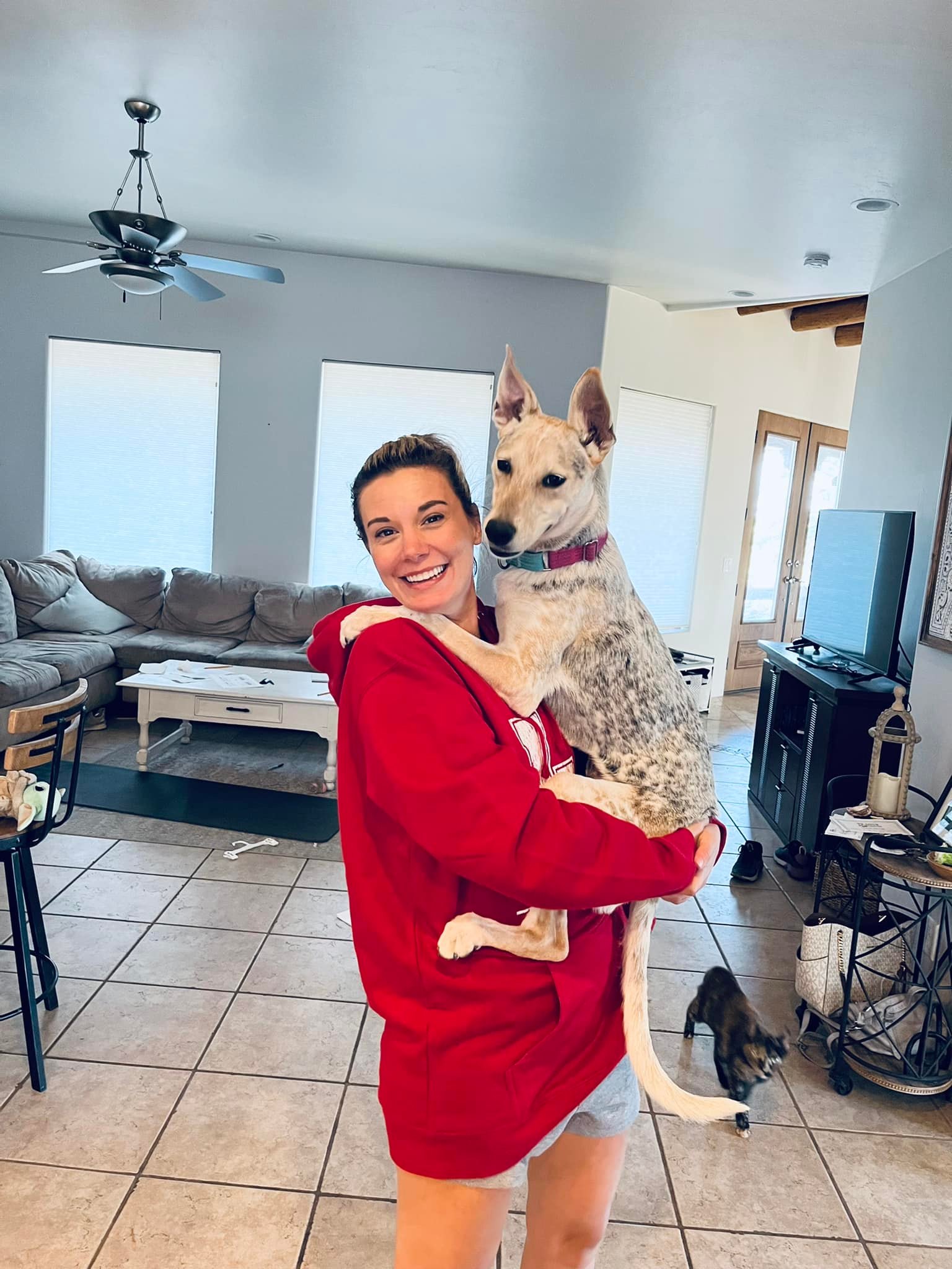 woman holding a coyote