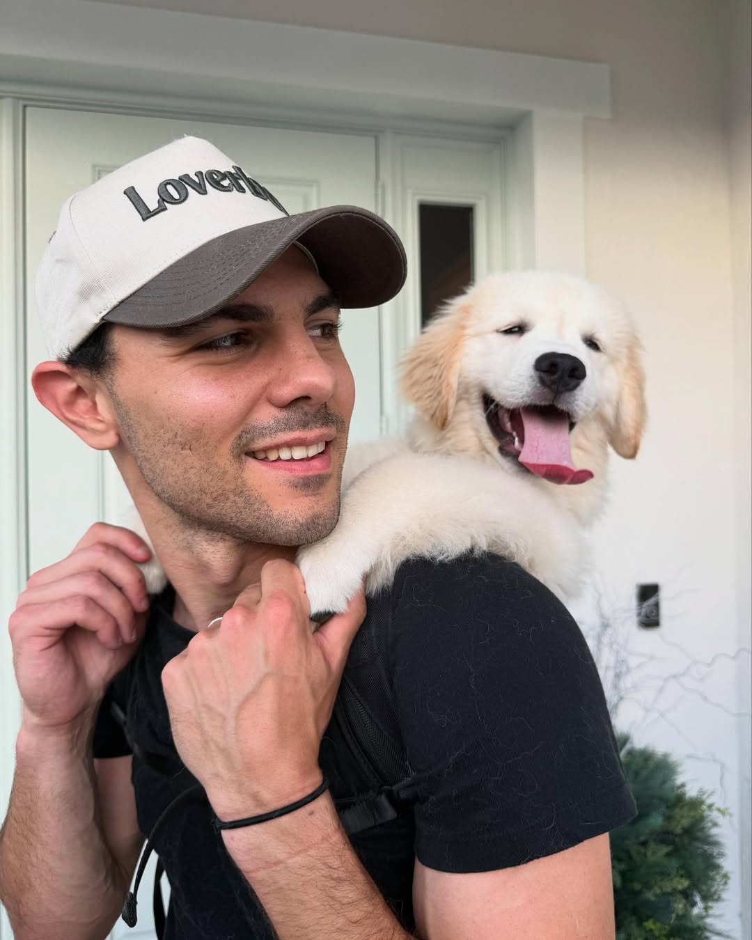 man holding dog on back