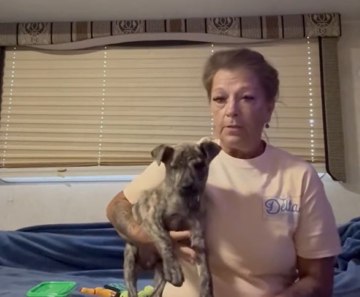old woman and puppy