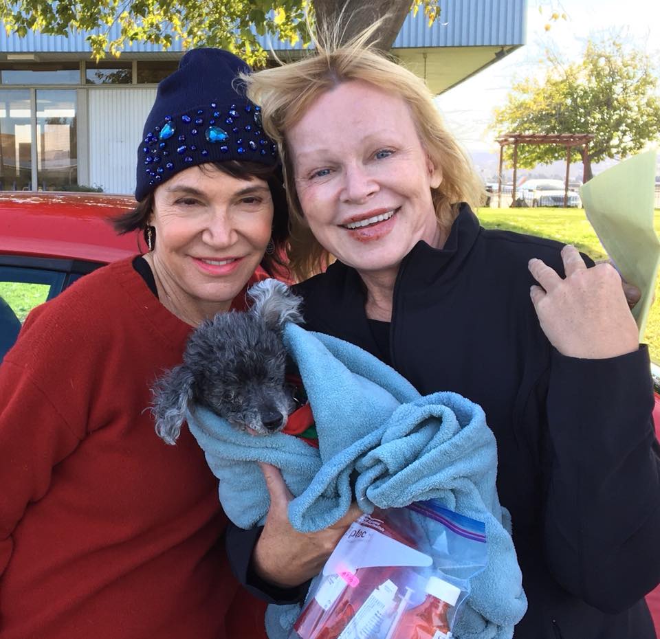 two women and a poodle