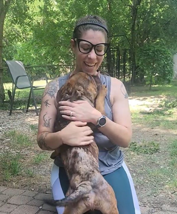 woman hugging a dog