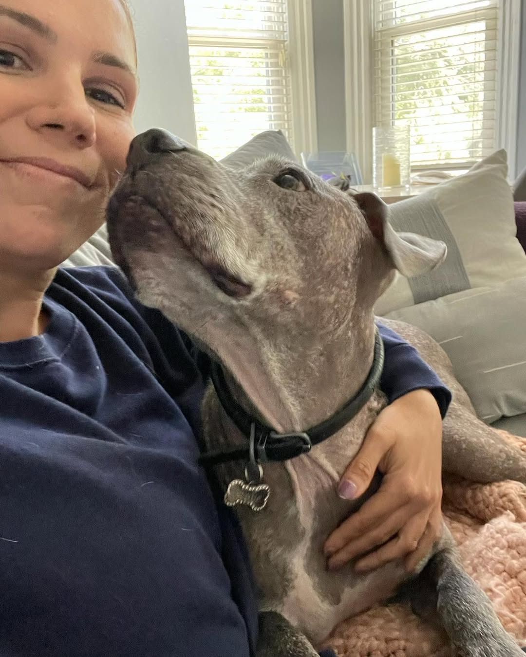 hairless dog hugging mom