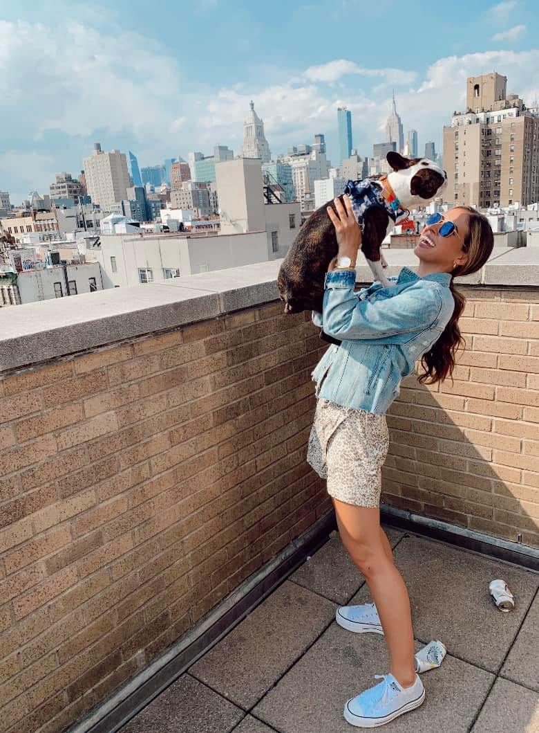happy woman holding a dog